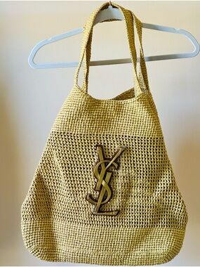 Designer-Inspired Beige Woven Tote with Signature Metal Emblem.